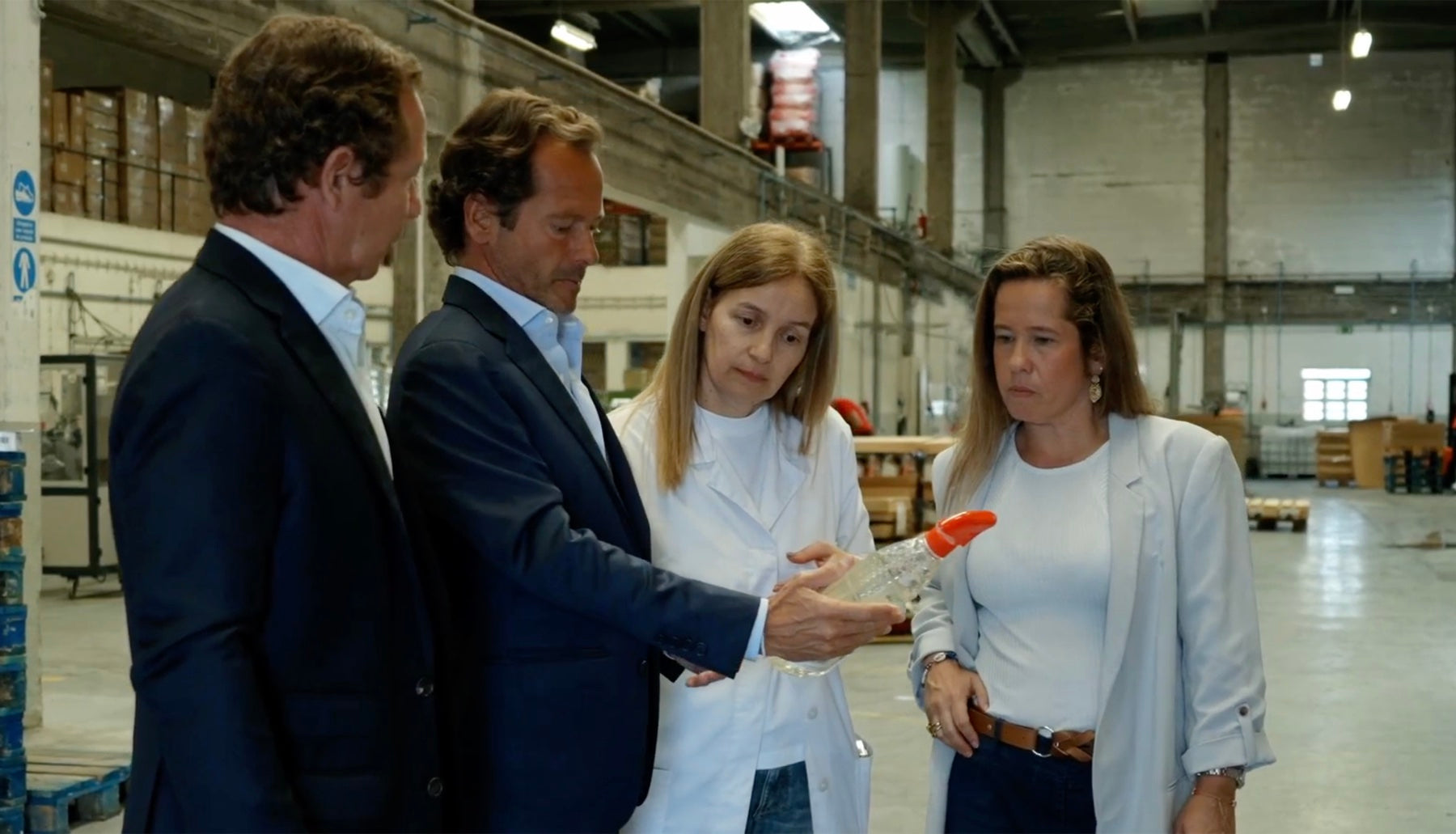 Plurifil team at the factory, examining a container